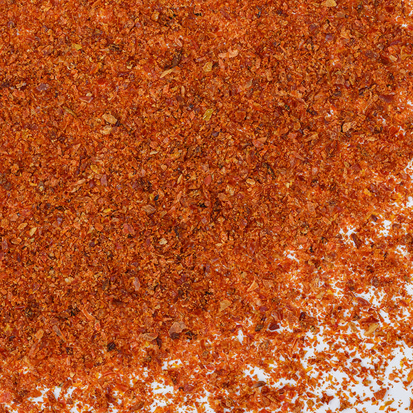 Sun Dried Tomatoes Granulated by Whole Spice Inc. are perfect for sprinkling over pasta or adding a burst of flavor to salads—enjoy sun-dried tomatoes at their best.