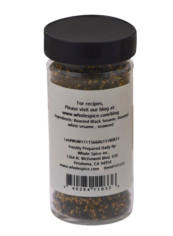 A black-lidded spice jar from Whole Spice Inc. shows a label for Japanese RiceSeaweed Seasoning - Classic, listing roasted black sesame seeds, roasted white sesame, and seaweed as ingredients. Website, address, and barcode appear at the bottom.