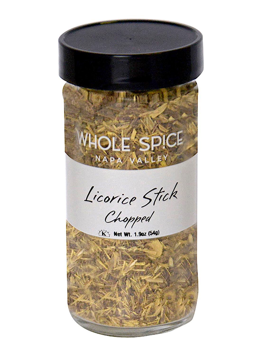 A clear glass jar with a black lid contains chopped licorice sticks. The label reads Whole Spice Inc. Licorice Sticks Chopped and states the net weight as 1.9 oz (54 g).