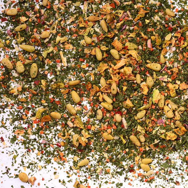 Parsley and Pine Nuts Quinoa Seasoning by Whole Spice Inc. is a vibrant blend of green herbs, yellow-orange veggies, and beige pine nuts—perfect for adding flavor and color to your favorite quinoa dishes.