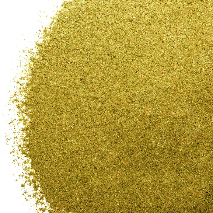 A close-up of a pile of Poultry Seasoning by Whole Spice Inc. on a white background, displaying its fine, powdery texture—perfect as an herb or soup seasoning.
