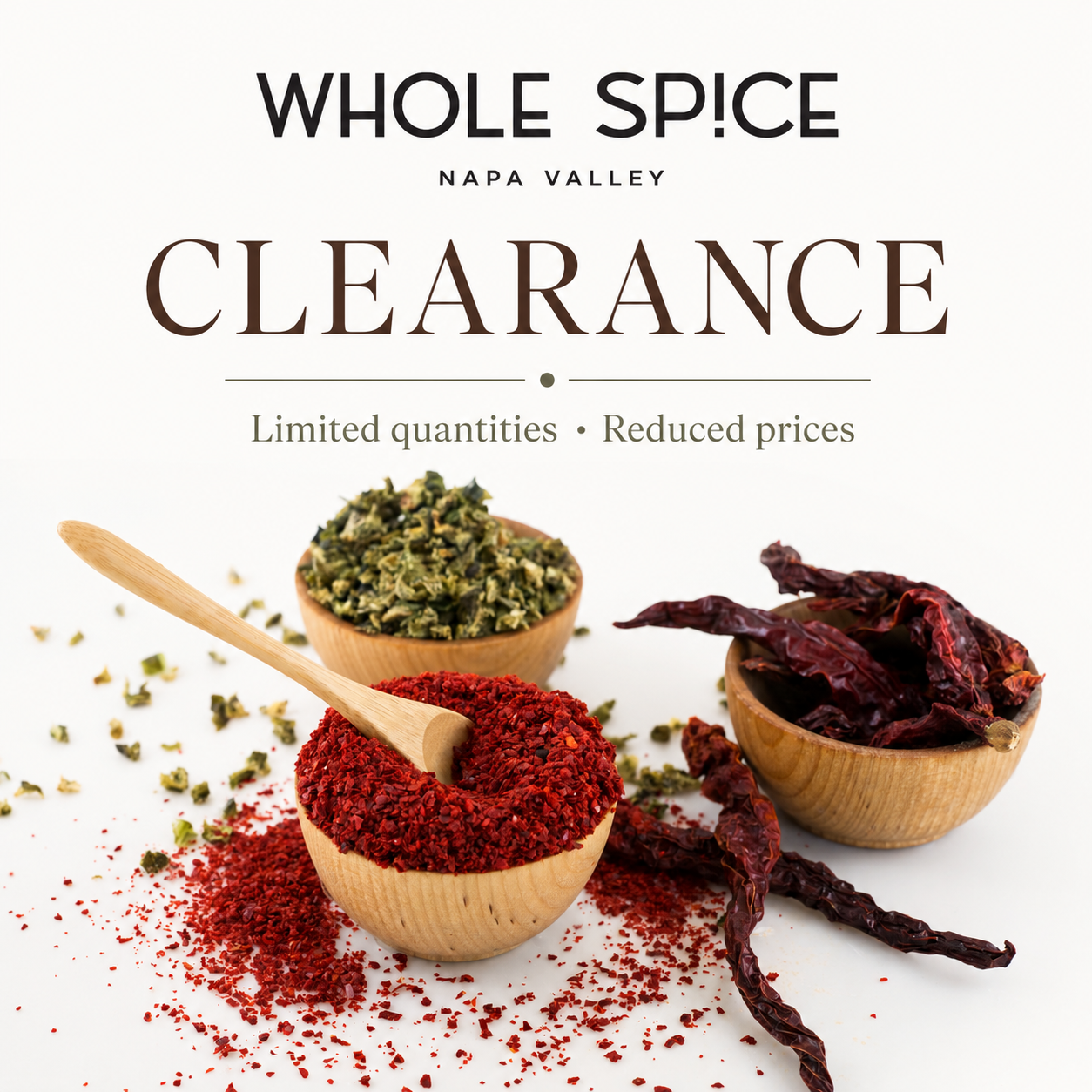 A Whole Spice clearance sale ad with bowls and wooden spoons filled with colorful spices and dried peppers on a beige surface. Text mentions limited quantities and reduced prices.