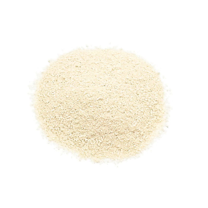 Whole Spice, Inc. Vanilla Sugar Powder—fine and light beige—is spread in a circular mound on a white background, ideal for baking desserts with all-natural vanilla flavor.