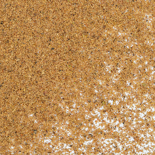 A close-up of Garam Masala by Whole Spice Inc.—a pile of brown flakes evoking the rich, warming spices of East Indian cuisine.