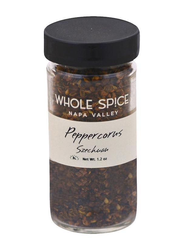 A 1.2 oz clear glass jar of Whole Spice Inc. Peppercorns Szechuan with a black lid and white label offers fragrant Szechuan pepper, ideal for adding bold flavor to poultry dishes.
