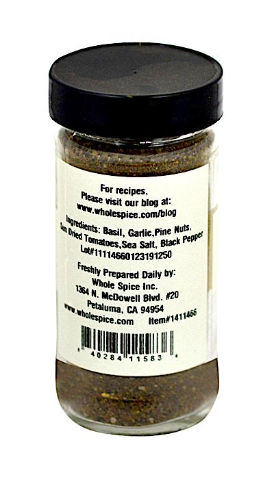 Whole Spice Inc. Pesto Seasoning comes in a clear jar with black lid and white label listing basil, garlic, pine nuts, sun dried tomatoes, sea salt, and black pepper—ideal for Italian pasta or pesto tortellini. Prep tips and website info included.