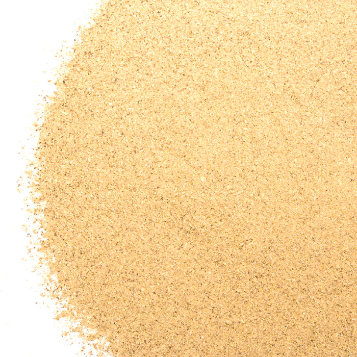 A mound of Whole Spice Inc. Portobello Mushroom Powder rests on a white background, resembling finely ground mushrooms.