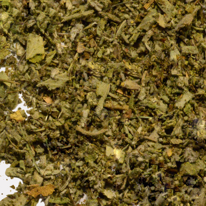 A close-up of Sage Crushed by Whole Spice Inc. shows dried, chopped green leaves and stems, ideal for adding fresh flavor to Mediterranean dishes or any herb blend.