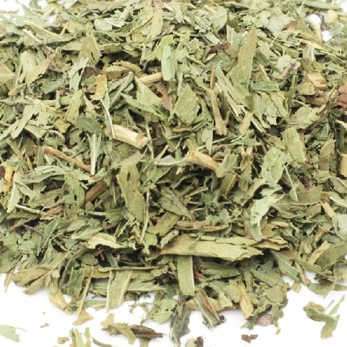 A close-up of Stevia Leaf by Whole Spice Inc.—dried, chopped leaves with rough, uneven edges—displayed on a white background as an herbal product.