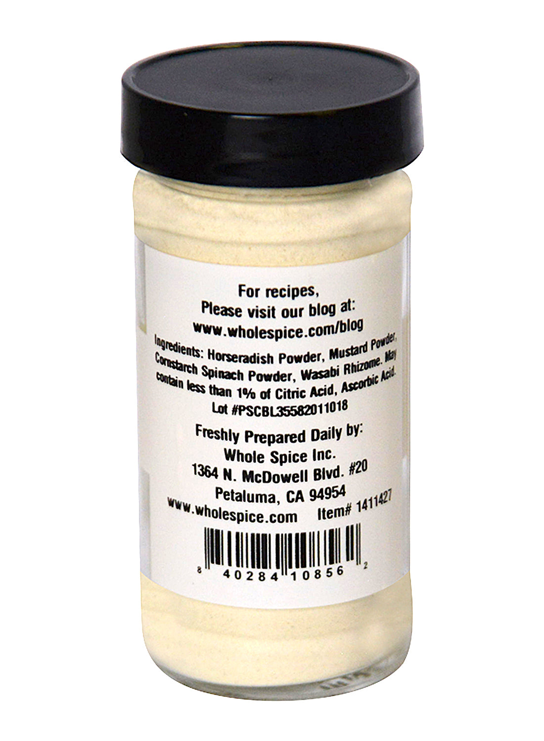 A clear spice jar with a black lid holds light-colored Wasabi Blend Natural by Whole Spice Inc. The label lists ingredients, a Petaluma, CA address, and a website for sushi seasoning recipes and more on this Japanese condiment.